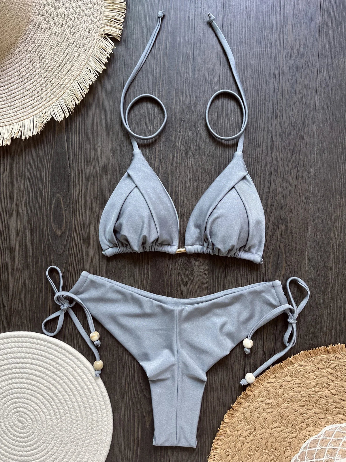 Two-piece foldable micro bikini set by The Clothing Company Sydney featuring triangle bikini top and matching bottoms for beachwear.