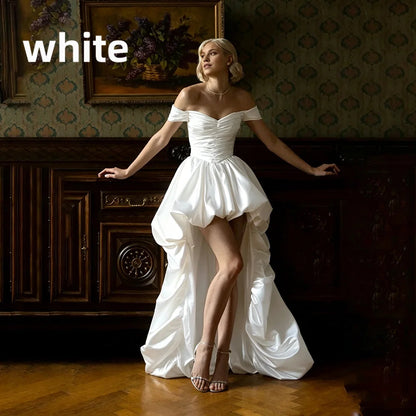 Satin off-shoulder bridal gown with ruched bodice, lace-up back, short front and long train wedding dress
