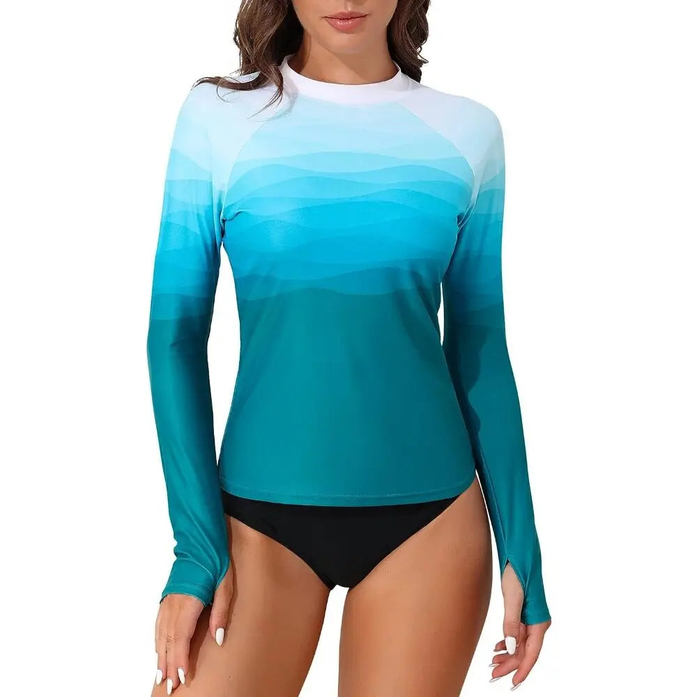 Women's long sleeve printed rashguard swimsuit by The Clothing Company Sydney with thumb holes, UPF 50+ sun protection, skin-friendly fabric.