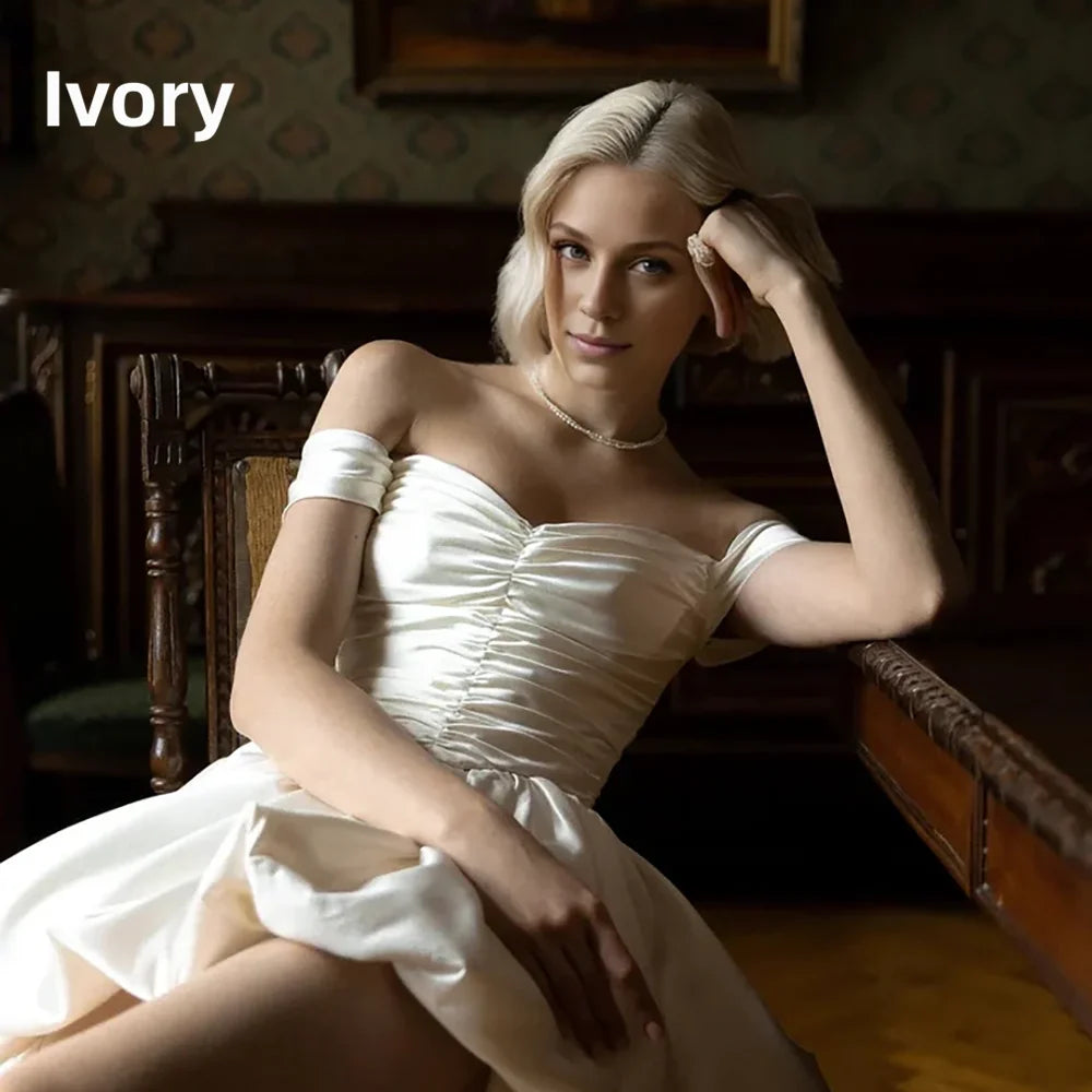 Satin off-shoulder bridal gown with ruched bodice, lace-up back, short front and long train by The Clothing Company Sydney