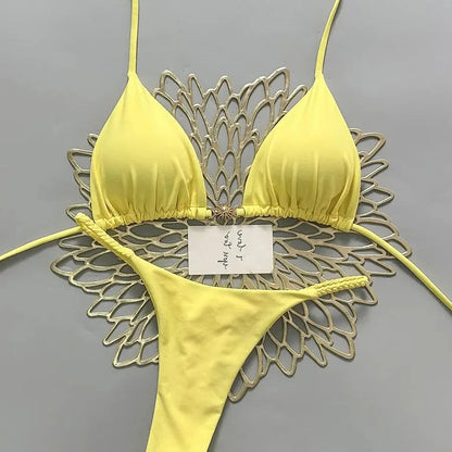 Backless Brazilian swimsuit set by The Clothing Company Sydney featuring lace-up print micro bikini and thong bottoms on a model.