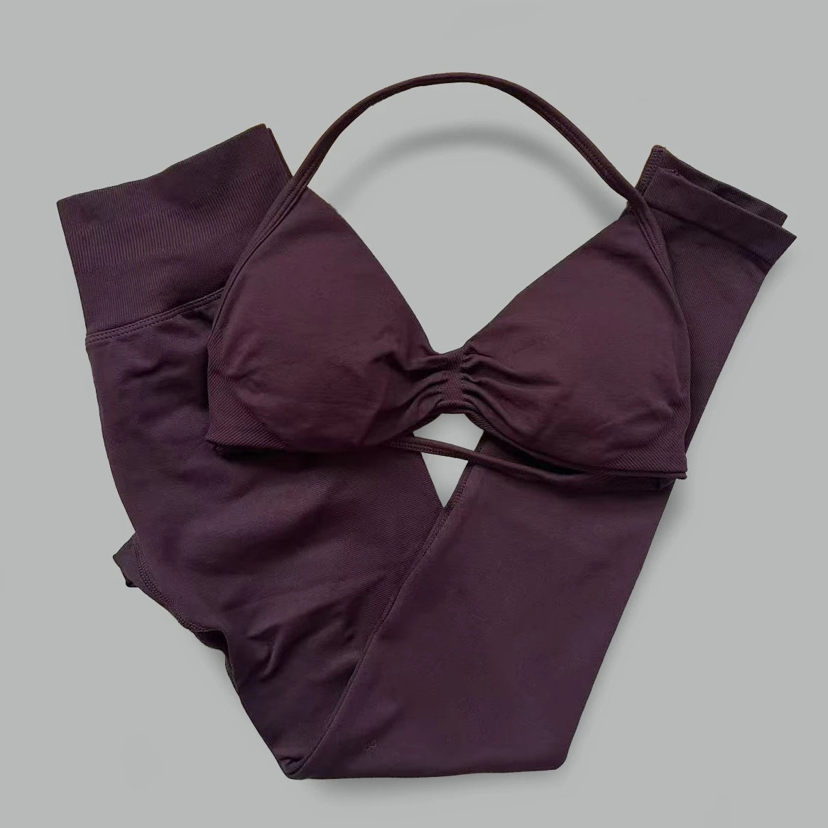 Women's seamless yoga set with halter neck sports bra and high-waisted lifting leggings by The Clothing Company Sydney