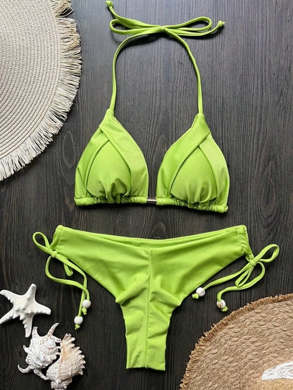 Two-piece women's micro bikini set with triangle tops and matching bottoms, perfect for beachwear and swimming.
